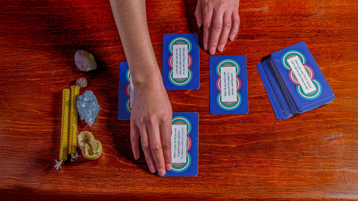 A hand resting on a face-down card